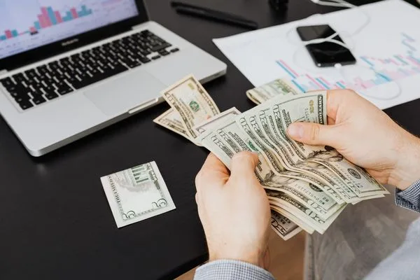 Customer Counting Money Order Funds During Transaction Review