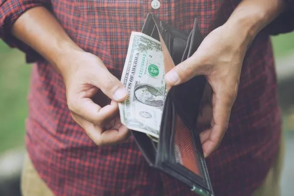 Cash received from a check cashing service, highlighting convenient access to funds for everyday financial needs.