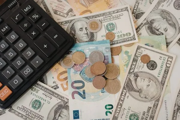 Currency Exchange Rates Displayed With International Cash And Calculator