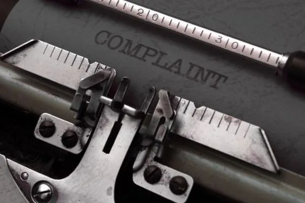 Typewriter Complaint Form Underscores Ethical Currency Exchange Standards